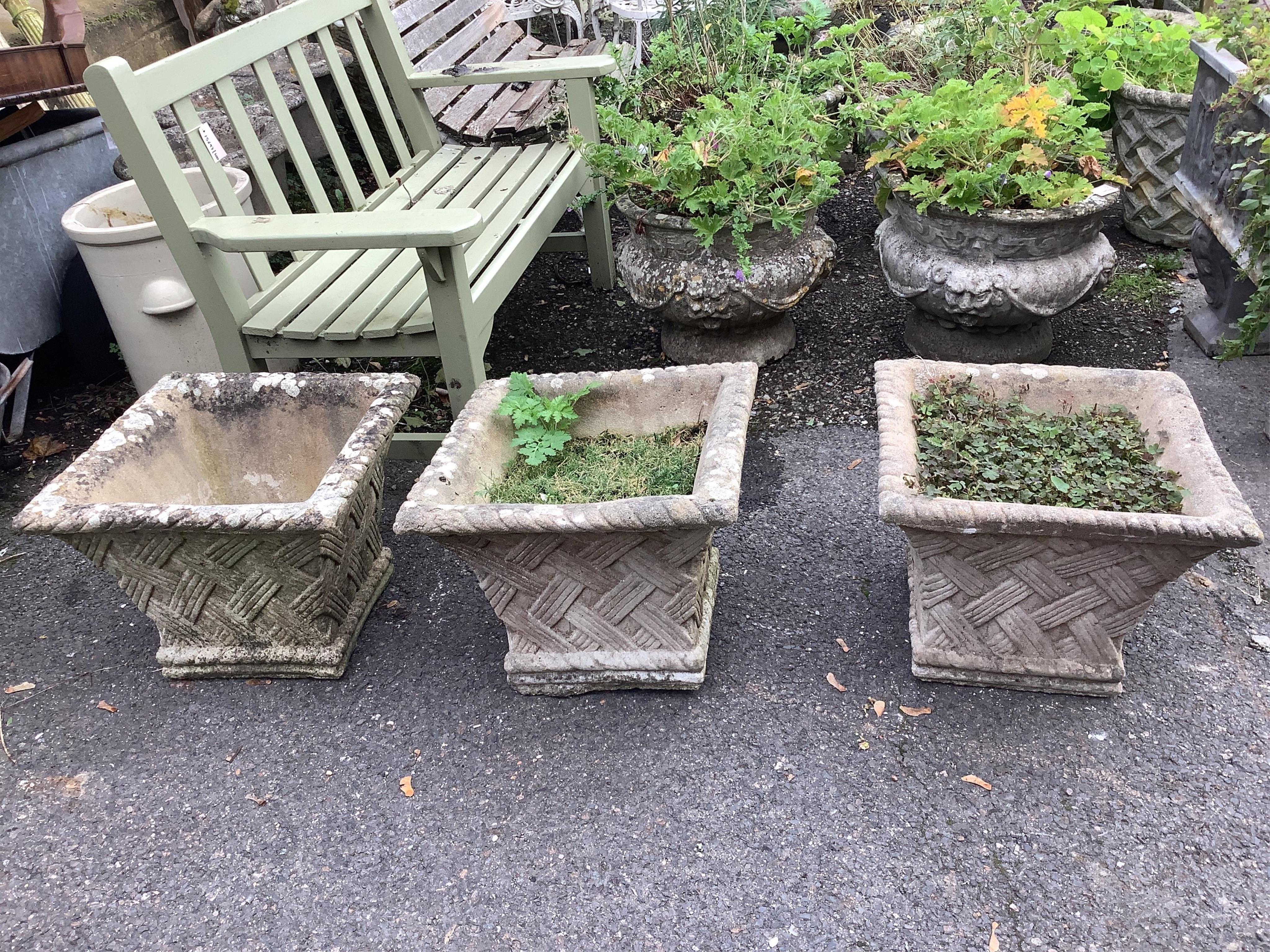 A set of three reconstituted stone square garden planters, 48cm, height 38cm. Condition - fair